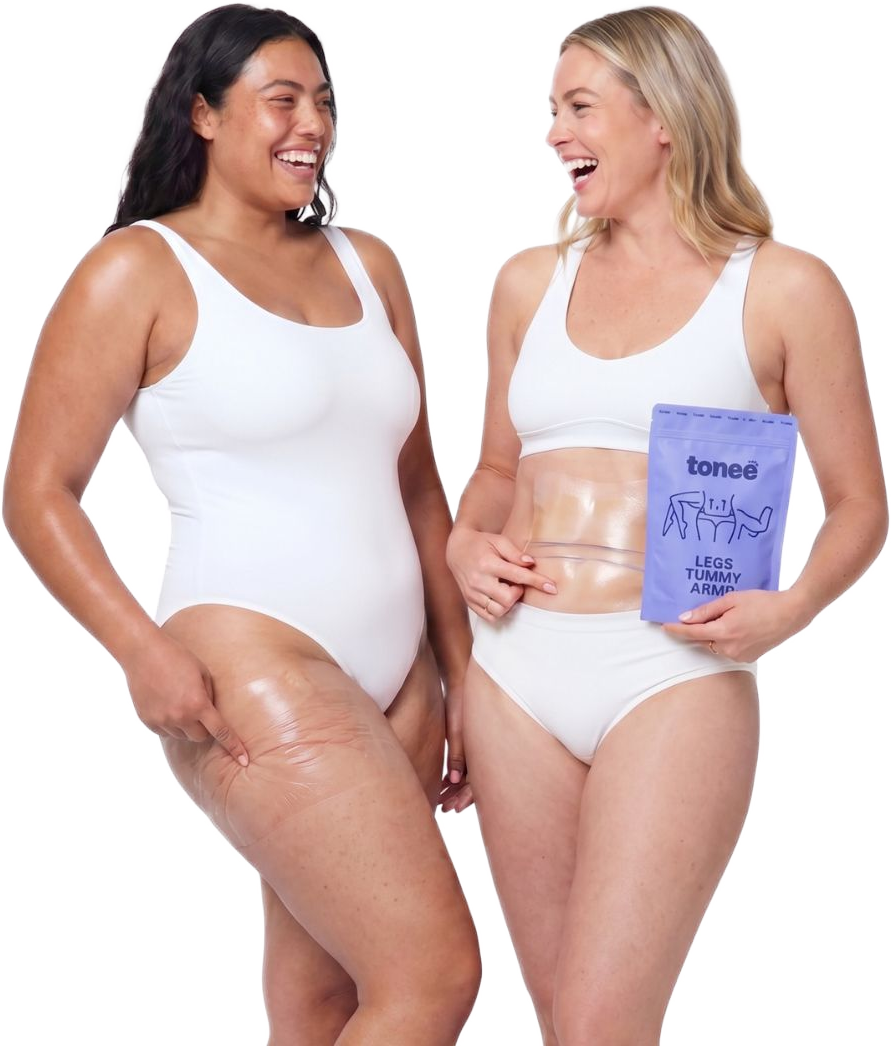 Two women laughing together, one holding a Tonee Legs, Tummy & Arms pack